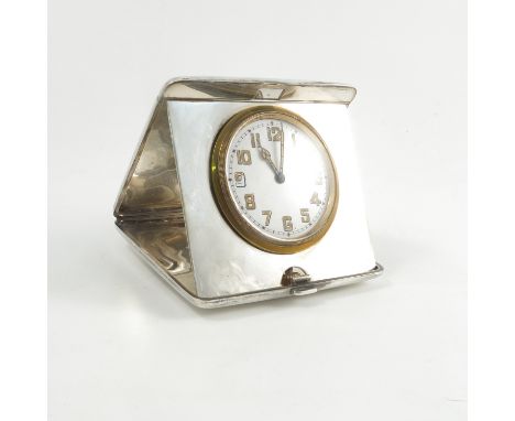 A silver cased travelling clock, the hinged case engraved with initials, Birmingham 1919   Condition report:  Movement winds 