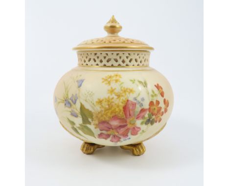 A Royal Worcester blush ivory pot pourri, decorated with floral sprays, having a pierced cover and inner cover, raised on thr