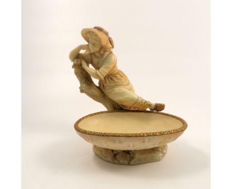 A Royal Worcester Hadley blush ivory figure, of a young girl resting on a tree with oval bowl in front, shape number 1178, da