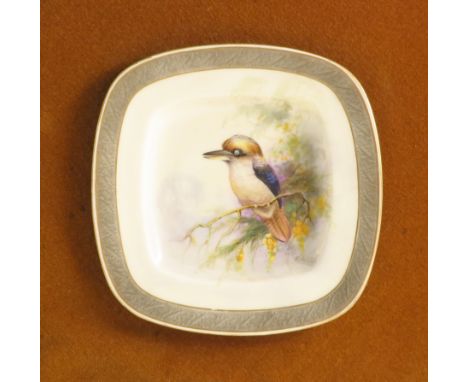 A Royal Worcester square plate, decorated with an Australian Kookaburra perched on a branch with foliage by R Austin, with em