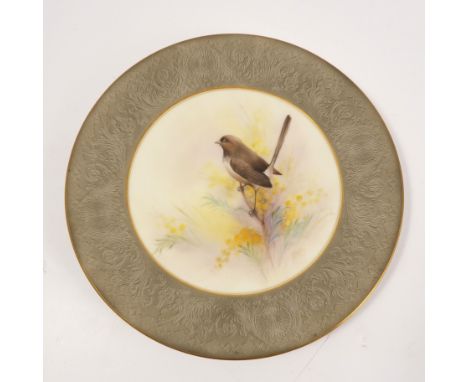 A Royal Worcester plate, decorated with a native Australian bird on a flowers Wattle bush by R Austin, to a grey embossed bor