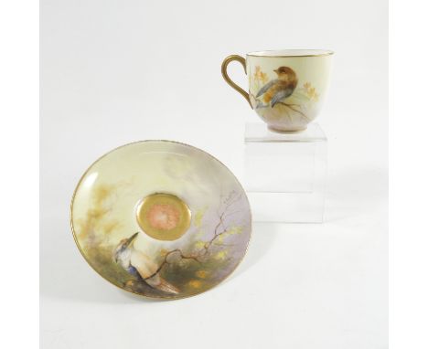 A Royal Worcester cabinet cup and saucer, the exterior of the cup and the saucer decorated with two different native Australi