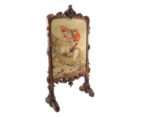 A 19th century walnut fire screen, with a tapestry panel of Napoleon, within a pierced and carved frame, height approximately