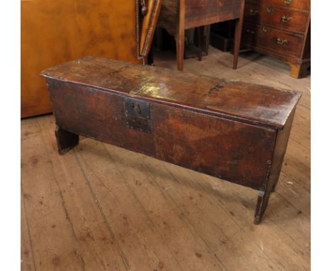 A 19th century elm coffer or box, with plain rising lid, raised on bracket feet, width 14ins