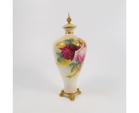 A Royal Worcester covered vase, the cover decorated with the leaves, the body decorated with roses by M Hunt, to four gilt fe