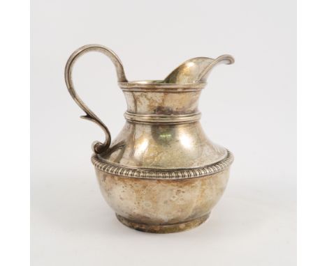 A silver cream jug of squat baluster form, with gadrooned band, London 1803, maker Paul Storr, weight 6oz   Condition report: