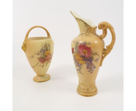 A Royal Worcester blush ivory vase, decorated with floral sprays, having a fixed handle over and lion mask, dated 1907, heigh