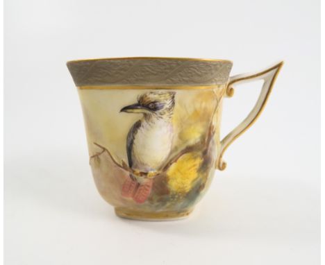 A Royal Worcester square section coffee cup, embossed and decorated with an Australian Kookaburra on a branch with foliage by