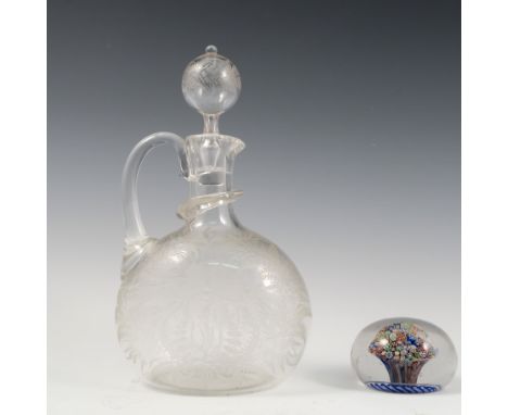 A 19th century glass decanter, of ovoid form, the blown glass stopper and body etched with ferns and flowers, the body with s