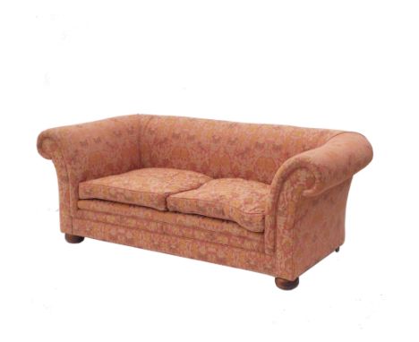 A Liberty style Chesterfield two seat sofa, with scroll arms raised on short turned wooden feet, width approximately 76ins