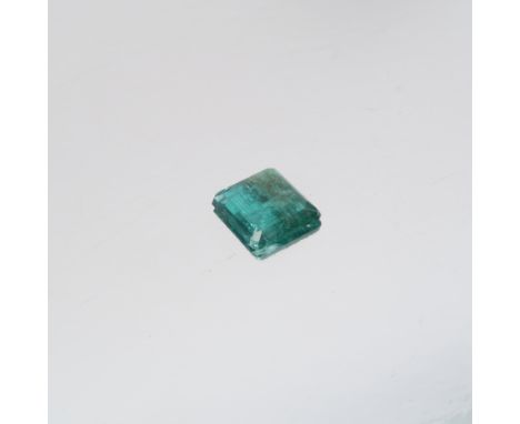 A step cut emerald, measuring approximately 8.3mm by 7.2mm by 2.3mm deep, 0.3 g grams