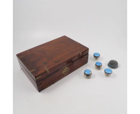 A 19th century mahogany writing box, with inset brass to the rectangular top and triangular plaque to the front, the interior