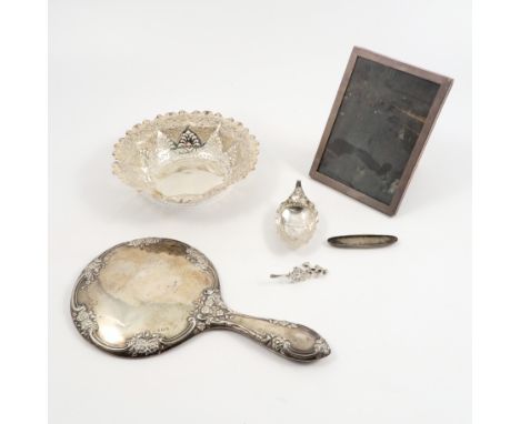 A collection of hallmarked silver, to include a pierced dish, af, a dressing table hand mirror, a photograph frame with woode