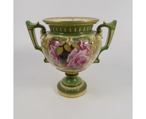 A Royal Worcester pedestal vase, with green neck, handles and pedestal foot, the body decorated with roses, shape number H193