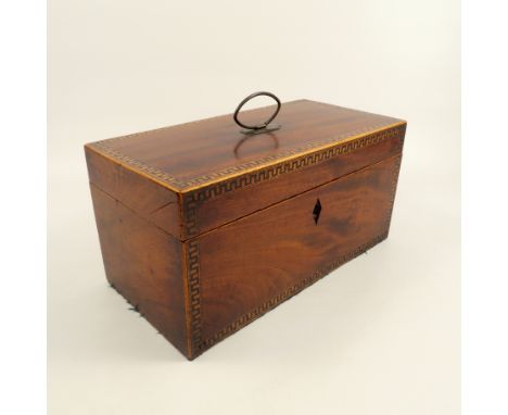 A 19th century mahogany tea caddy, of rectangular form with Greek Key inlaid border to top and front, the interior fitted wit