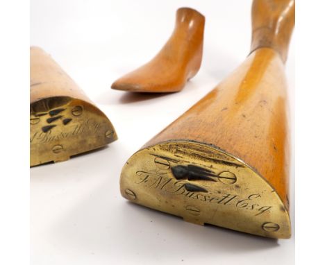 A pair of 19th century wooden boot trees, in three sections, with brass plaques to the tops engraved F M Bussett Esq. M Wilds
