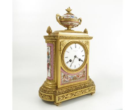 A 19th century gilt metal and porcelain mantel clock, the striking movement stamped for Jean-Baptiste Delettrez, the white en