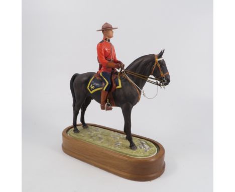 A Royal Worcester limited edition model, Royal Canadian Mounted Policeman, modelled by Doris Lindner, with plinth and certifi