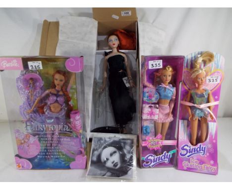 Dolls - an Ashton Drake GENE doll entitled Share The Dream, with stand and certificate in original box, a Barbie Fairytopia, 