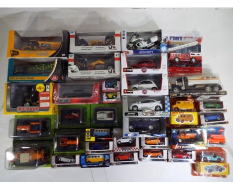Diecast - a quantity of boxed diecast model motor vehicles to include Burago / Bburago, Welly Hachette Partworks farm vehicle