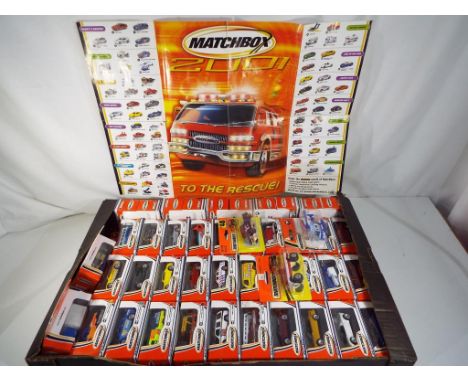 Matchbox - 75 diecast Matchbox vehicles in original window boxes from year 2000 lot also includes the poster from 2001, items