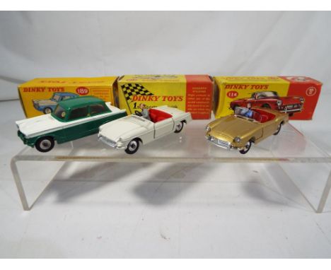 Dinky - three diecast vehicles in original boxes comprising #113 M.G.B sports car, #114 Triumph Spitfire and #189 Triumph Her