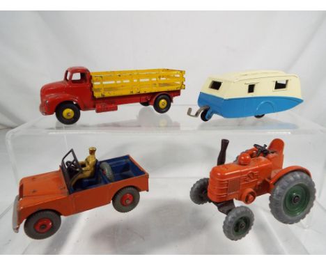 Dinky - four unboxed diecast vehicles comprising #190 Caravan, #301 Field Marshall Tractor, #340 Land Rover and #417 Leyland 