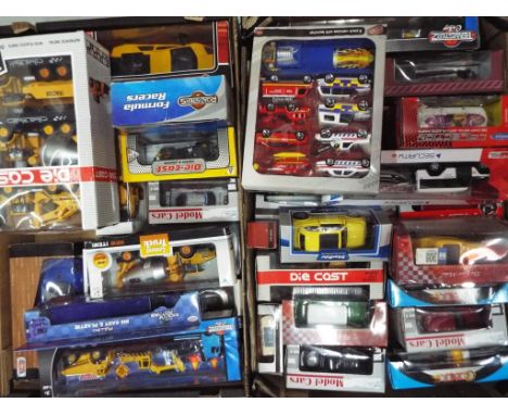Diecast - a lot to include a quantity of boxed diecast model motor vehicles of varying scales, models appear m in vg to nm bo