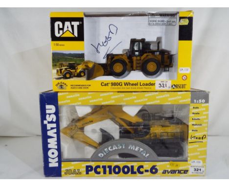 Two 1:50 diecast model construction vehicles to include a Norscot Cat 980G wheel loader and a Joal Komatsu excavator and shov