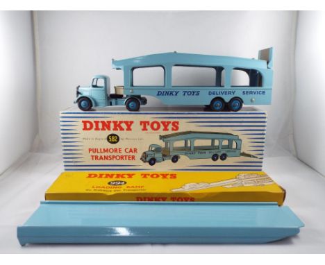 Dinky - a #582 Pullmore car transporter in nm with a few scuff marks in e box and a #994 loading ramp for the Pullmore car tr