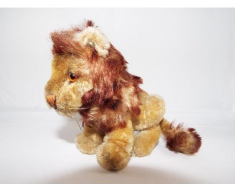 Steiff - a small Steiff lion entitled Leo bearing button in ear and with stitched nose and mouth, approx 11cm (h) Est £20 - £