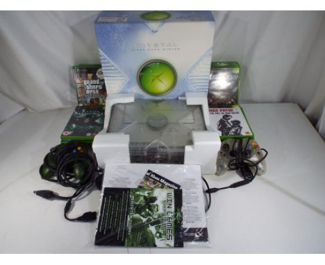 X - Box -  original Crystal Clear console in box with instructions, two controllers and seventeen games, items appear to be i