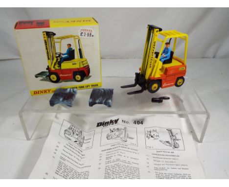 Dinky - #404 Conveyancer Fork Lift Truck with pallet and instructions in near mint to mint condition in excellent box, Est £4