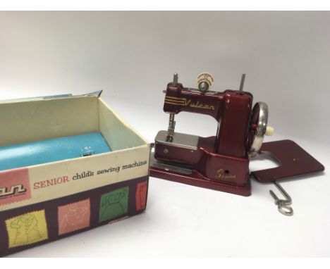 A Vintage Vulcan senior child's sewing machine with original box.