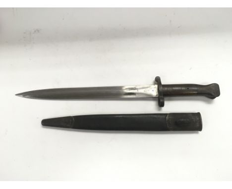 A Remington bayonet and scabbard.