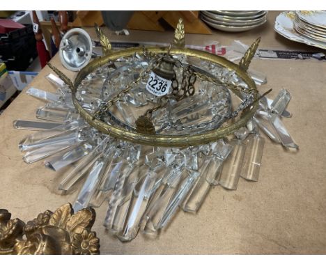 A small gilt chandelier light fitting.