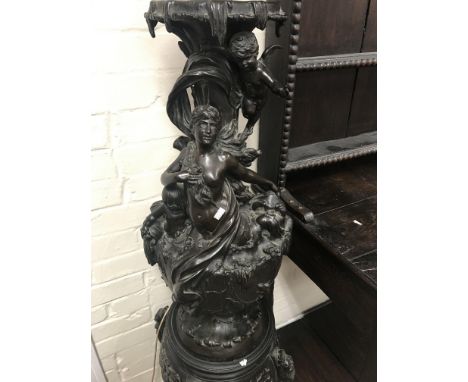An impressive bronzed lamp of the Art Nouveau style , in the form of cherub mermaids stylised dolphin surrounded by naturalis