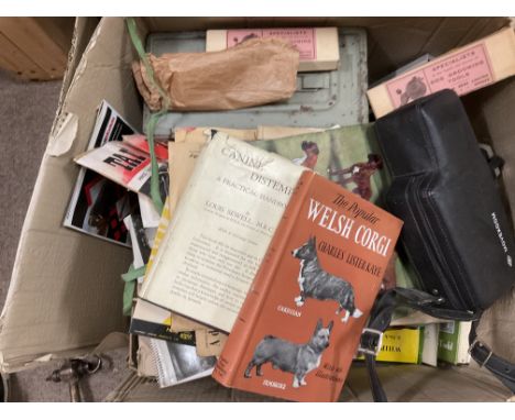 A large collection of vintage dog related ephemera, grooming tools etc.