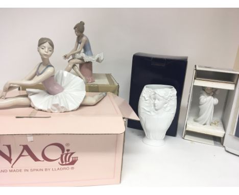 A boxed Lladro figure Bundled Bather, two Boxed Nao ballerina figures and a Franz porcelain vase (4)