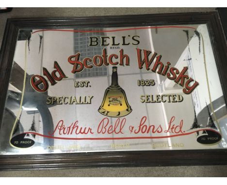 A framed Bells old scotch whiskey advertising mirror 65 cm by 98 cm