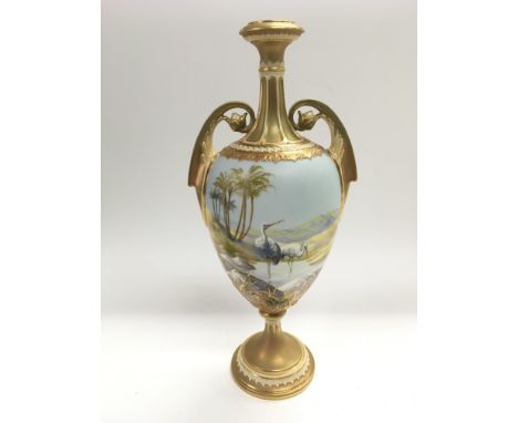 A Royal Worcester trophy vase handpainted by William Powell depicting wading birds in a landscape setting with giltwork decor