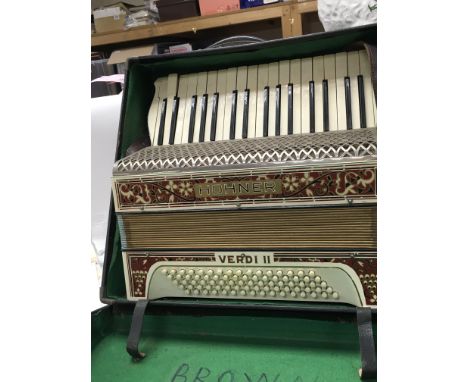 A vintage cased Hohner Verdi II accordion.