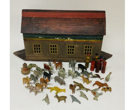 A 19thC German wooden model of NoahÃ¢Â€Â™s Ark and a large collection of animals. L.57cm