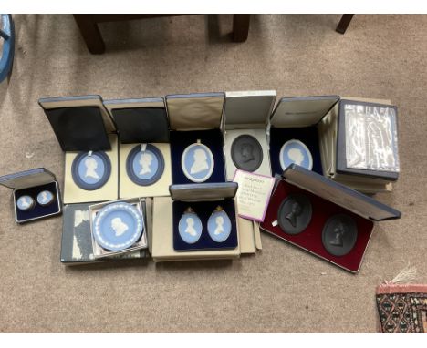 A collection of Wedgewood Jasperware and Black Basalt medallions/plaques all boxed 17, including a pair of hallmarked silver 