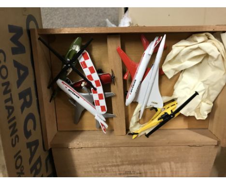 A suitcase containing model cars, boxed trains including a small collection of N gauge.