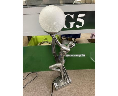 A modern Art Deco style lady lamp.