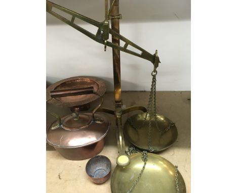 A small collection of copper and brass scales with weights ..