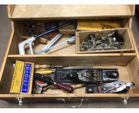 A carpenter's box containing various tools including a Stanley wood planes 405 073 and other tools.