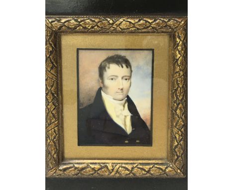 A framed portrait miniature of a Victorian gentleman.