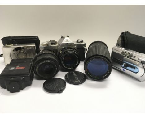 A Pentax camera and various lenses plus two digital cameras and photographic equipment.